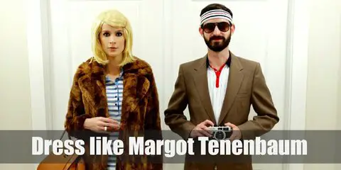 Margot Tenenbaum loves wearing her brown fur coat with a casual polo dress underneath. Margot adds an air of innocence to her look by putting a single clip on her blonde bangs.  