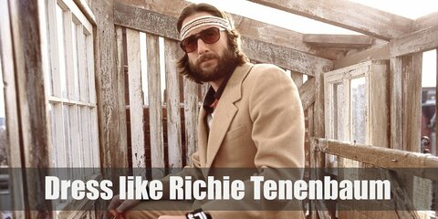 Richie Tenenbaum’s costume is a hybrid of athleticism and looking proper. He wears a beige three-piece suit with a striped sports shirt underneath, a pair of black Oxfords, and sweatbands.  