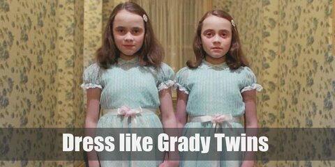 The Grady Twins costume is the same dress and look identical to the last detail. The twins both wear innocent-looking light blue Sunday dresses, white stockings, and black Mary Janes.  