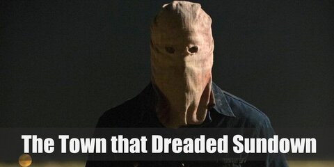 The Town That Dreaded Sundown's costume features a burlap sack as a head cover, denim button-downs, and a pair of khaki pants.