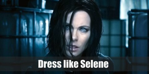Selene wears a super tight black leather bodysuit, black corset, black leather coat & combat boots.