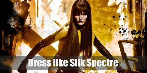 Silk Spectre costume is a tight yellow dress with a corset belt to reveal her shape, black leather choker and long gloves, and laced up leather boots with sheer black stockings.