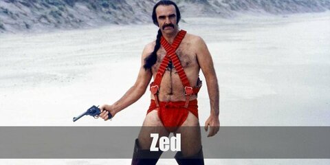  Zardoz’s costume is a red brief, red suspenders, knee-high boots, and a black long-braided wig while carrying a revolver. 