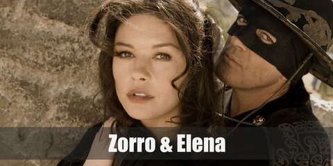 Zorro costume is most known for his all-black ensemble. He wears a black tunic, black pants, black boots, a billowing black cape, a black Spanish hat, and a black mask. Elena’s costume is a white renaissance dress with a white corset, brown riding boots, and a choker necklace with a medallion as its pendant. 