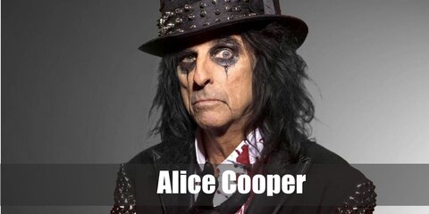  Alice Cooper’s costume is a white long sleeve button down shirt with splashes of red blood, black leather pants, mid-top black leather boots, a black cummerbund, a black belt with a large buckle, a black leather blazer with gold sequined sleeves, a black gold-sequined tall hat, and black leather gloves.