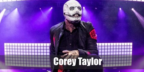  Corey Taylor’s costume is a short-sleeved black stretch button-down shirt, straight-fit stretch black denim jeans, blue denim sneakers, a black lightweight jacket with red Slipknot markings, and a Corey Taylor Slipknot mask.