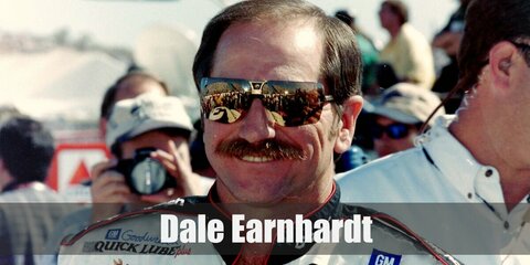 Dale Earnhardt's costume features his driving uniform with lots of brand logos. He pairs it with dark shoes, shades, and a well-kept mustache.