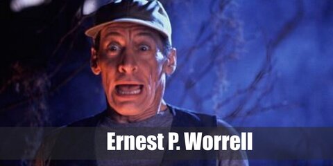 Ernest P Worrell’s costume is a short-sleeved crew neck gray T-shirt, stretch blue denim jeans, black slip-on walking sneakers, a blue denim utility vest, and a khaki baseball cap.