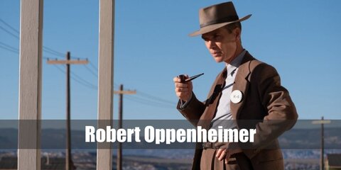  Oppenheimer’s costume is a light blue dress shirt, a black tie, a classic-fit blazer and pair of pants, and a gray fedora.