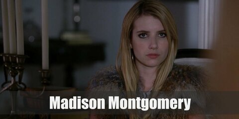 Madison Montgomery costume is her dark ensembled featuring a black halter top or dress and boots. She also styled her look with a pair of black sunnies and high boots. 