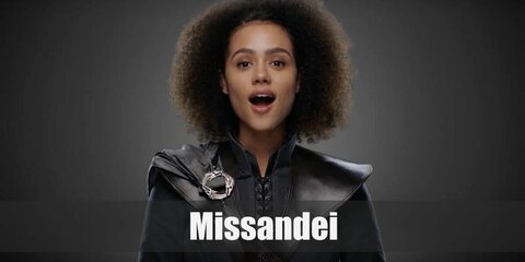 Missandei’s costume is a light blue, sleeveless dress, brown sandals, brown curly hair, and a choker.  Missandei is one of Daenerys’ most trusted companions.