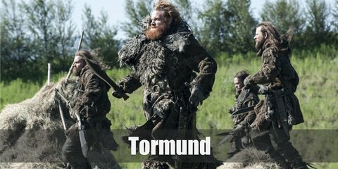  Tormund’s costume is a brown, long-sleeve shirt, brown pants, a brown robe, lots of fur, brown boots, and grey gloves. 
