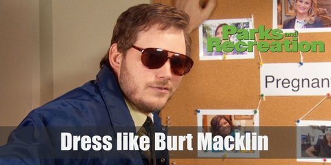 Burt Macklin looks like a super cool FBI Agent. He wears a light yellow shirt with a brown necktie around his neck, a blue FBI jacket, and awesome-sauce brown sunglasses.