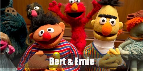  Bert and Ernie’s costume are a white turtleneck shirt underneath a striped sweater, olive pants, and beige shoes as well as a horizontally striped sweater, denim pants, and scruffy red sneakers.