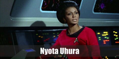Uhura wears a red dress with a Star Trek pin and styles it with boots.