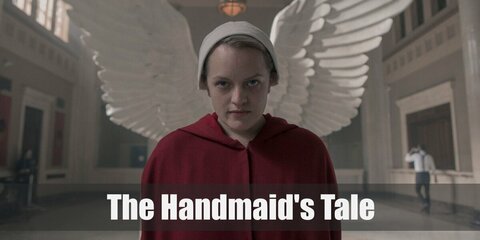 The Handmaid's costume is a red cloak and a white bonnet hat with a pair of black boots. Aunt Lydia’s costume is a brown cloak, brown coat, brown poncho, Oxfords, a brown belt, brown beret, brown gloves, a Fertility pin.