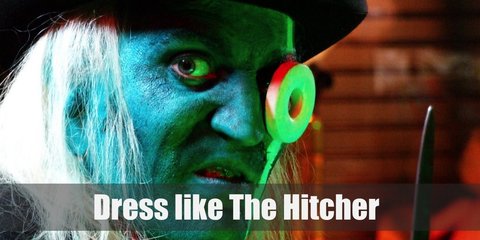  The Hitcher looks weird and creepy. He has green skin and a giant white Polo candy on one eye. He has white hair and wears all black with a top hat.  