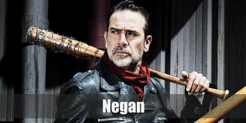 Negan’s costume is a red scarf, a black leather jacket, brown pants, black gloves, a salt and pepper fake mustache, and a bat with barbed wire.