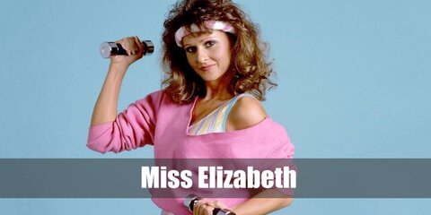  Miss Elizabeth’s costume is a strapless white mini tube dress, high-heeled white shoes with straps, white fashion arm sleeves, white fringe dangling earrings, and a wrestling championship belt.