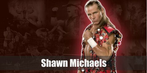Shawn Michaels’ costume primarily includes his amazing vest and comfy workout pants combo. His outfit can also be styled with gloves, knee pads, shin guards, and shoes. The pants he usually wear have prints on them, too.